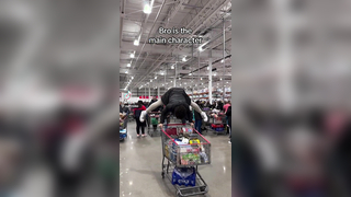 Man uses a shopping cart for gymnastics!