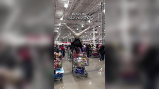 Man uses a shopping cart for gymnastics!
