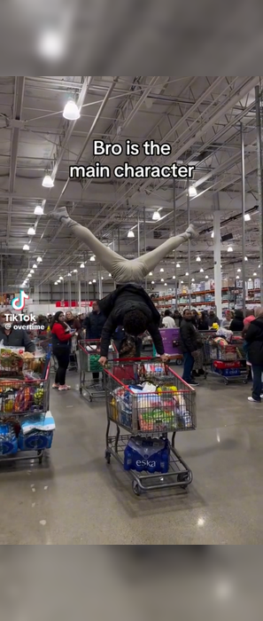 Man uses a shopping cart for gymnastics!