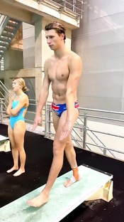 Mesmerizing Slow-Motion Dive: British Diver's Flawless Indoor Springboard Performance