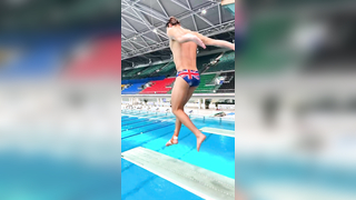 Mesmerizing Slow-Motion Dive: British Diver's Flawless Indoor Springboard Performance