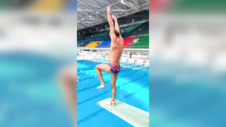 Mesmerizing Slow-Motion Dive: British Diver's Flawless Indoor Springboard Performance
