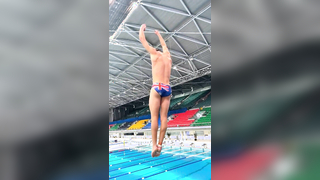 Mesmerizing Slow-Motion Dive: British Diver's Flawless Indoor Springboard Performance