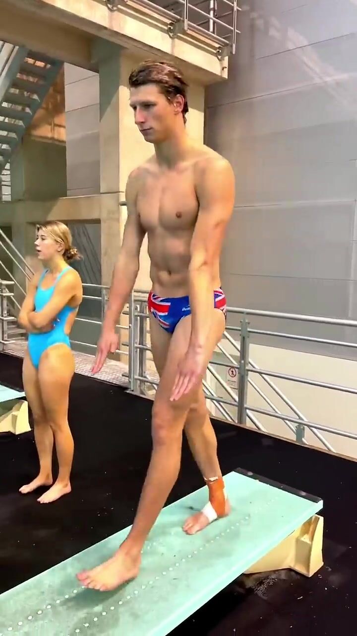 Mesmerizing Slow-Motion Dive: British Diver's Flawless Indoor Springboard Performance