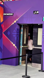 Panathinaikos owner Dimitris Giannakopoulos leaves the court and watches from the corridor.