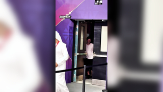 Panathinaikos owner Dimitris Giannakopoulos leaves the court and watches from the corridor.