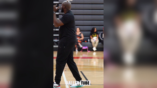 Coach Slim Leads Campers Through Dynamic Warmup Stretch at the Elite 60 Showcase