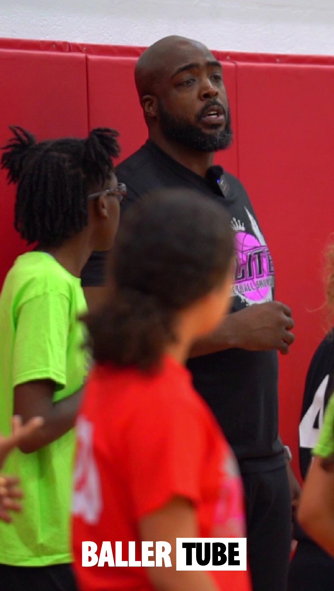 Coach Slim Leads Campers Through Dynamic Warmup Stretch at the Elite 60 Showcase