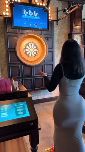 Just a girl playing darts