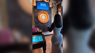 Just a girl playing darts
