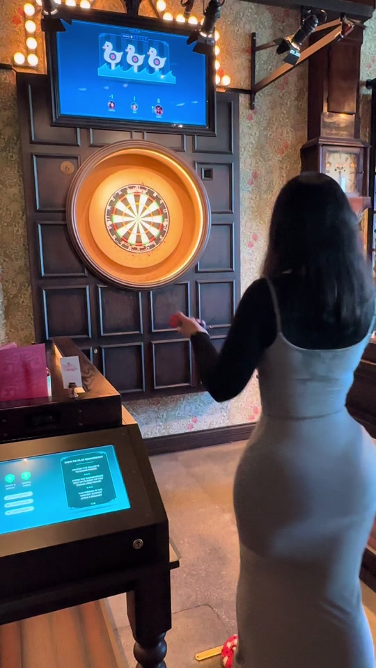 Just a girl playing darts