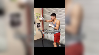 What is the name of the man in the grey shirt? #boxing
