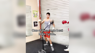 What is the name of the man in the grey shirt? #boxing