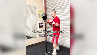 What is the name of the man in the grey shirt? #boxing