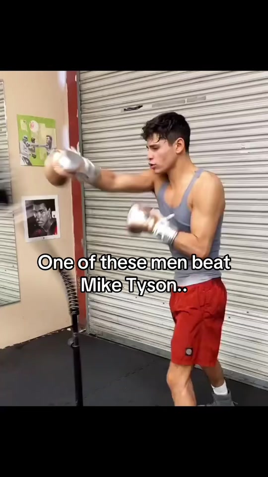 What is the name of the man in the grey shirt? #boxing