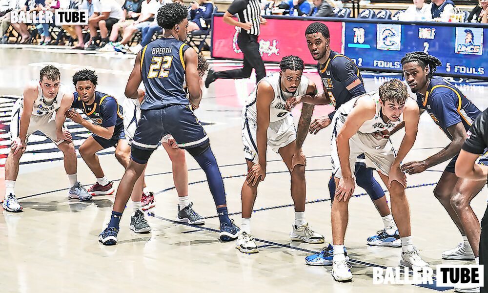 High school basketball players lined up on the court