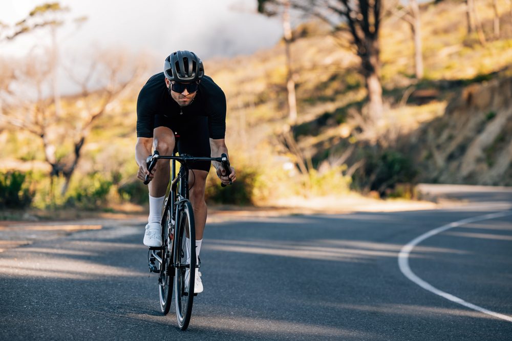 Cyclist racing on a mountain road