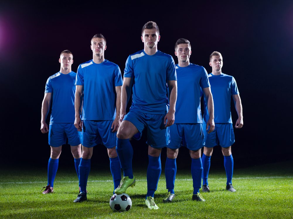 Soccer team lined up in blue kits