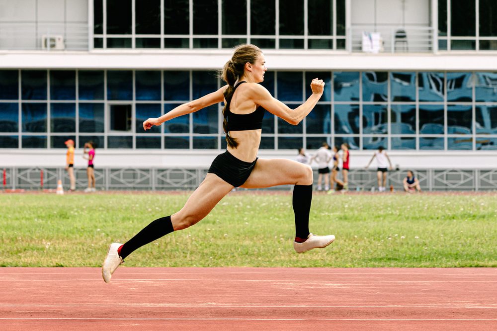 Sprinter driving out of the blocks on a track